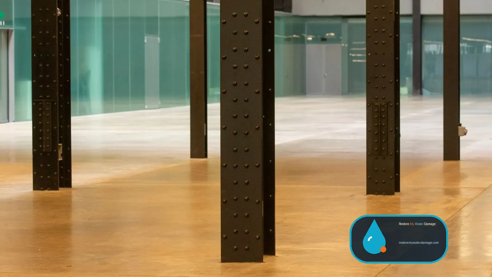 Industrial space with steel columns and a concrete floor, needing water damage restoration in Berks County Reading, PA