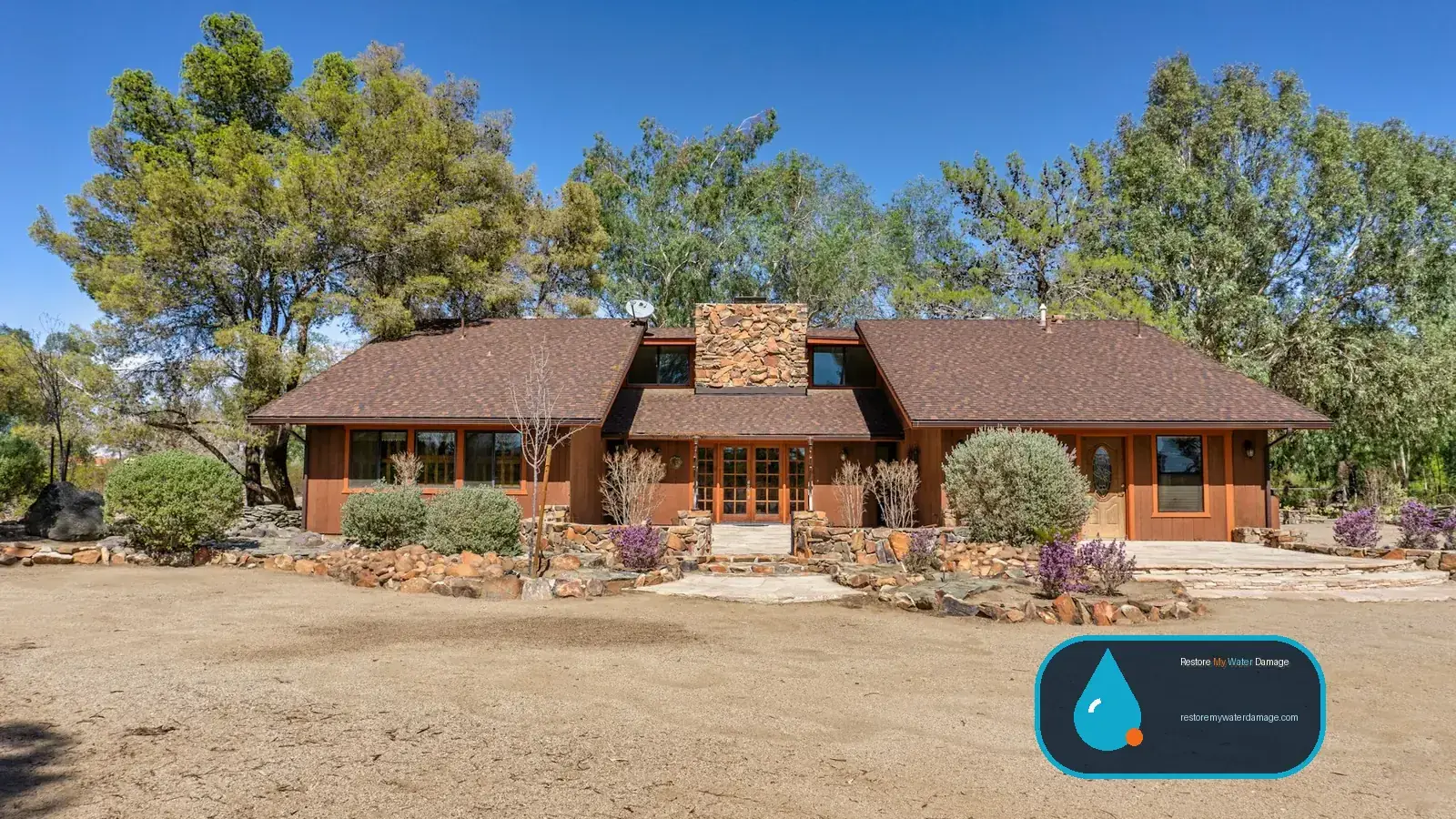 Ranch house with gravel yard and desert plants, served by water damage restoration North Las Vegas, NV