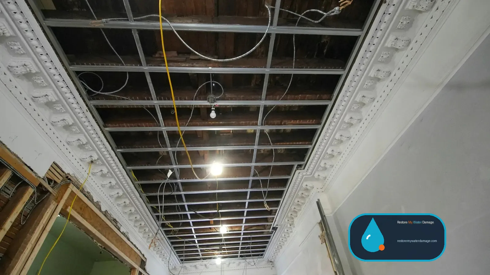 Interior ceiling opened down to its framing during repairs, a stage of water damage restoration Plano Richardson, TX