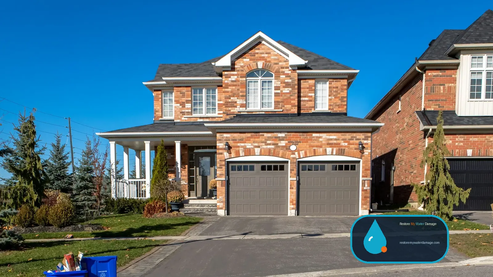 Two-story brick home with a double garage, a house type for water damage restoration Vancouver Southwest Washington, WA